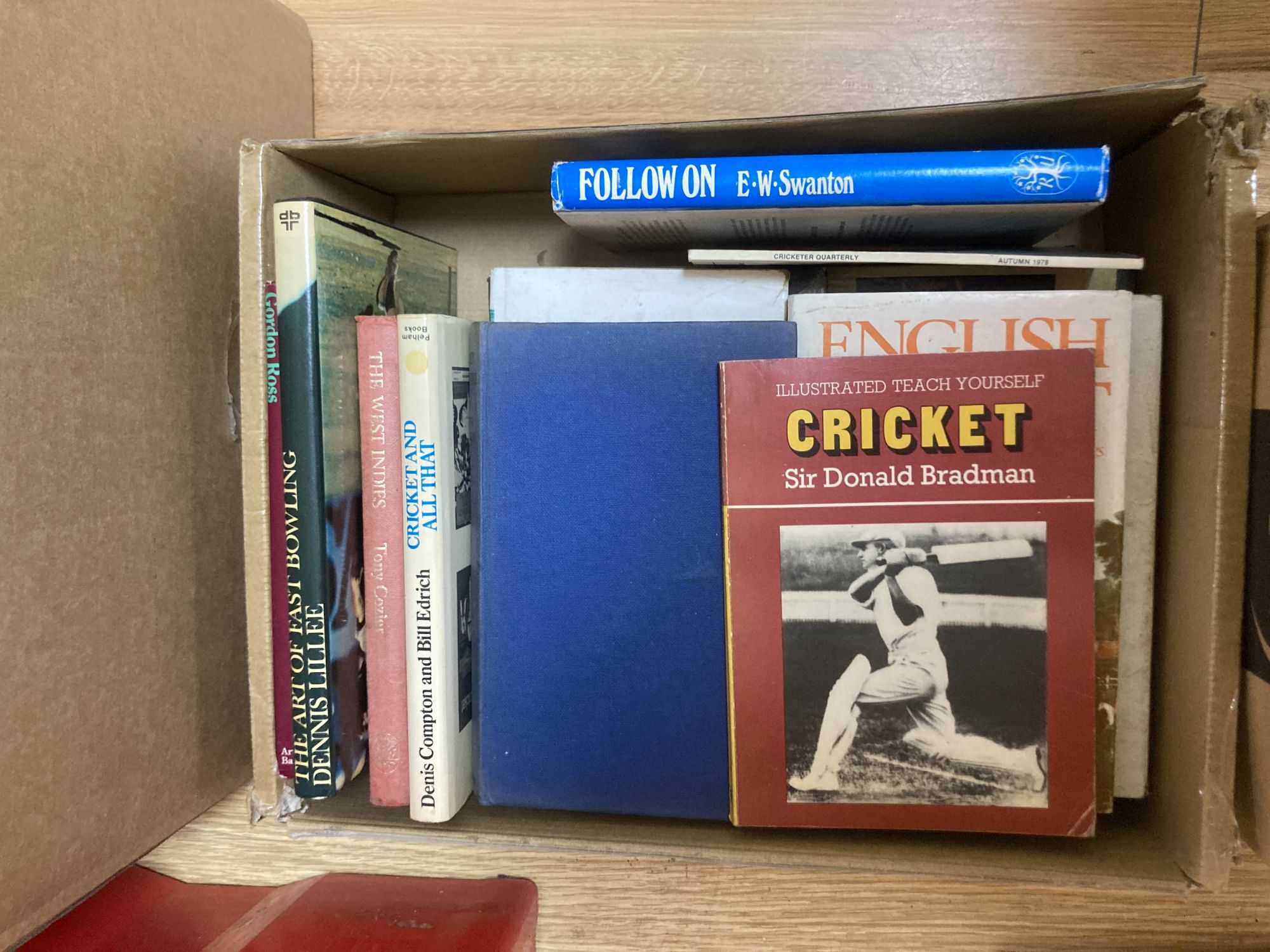 A quantity of cricket-related books